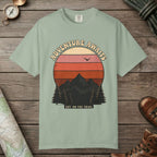 Bay color unisex graphic t-shirt with "Adventure Awaits Retro Sunset" design