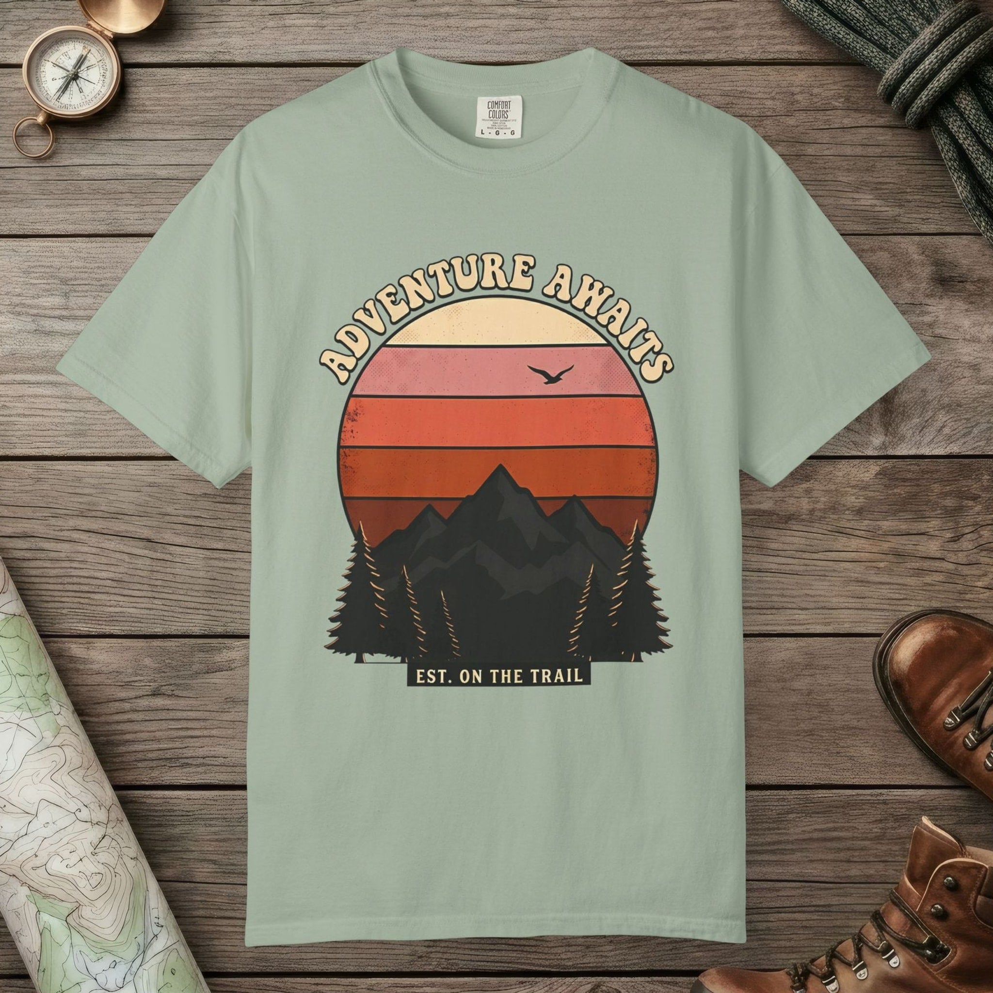 Bay color unisex graphic t-shirt with "Adventure Awaits Retro Sunset" design