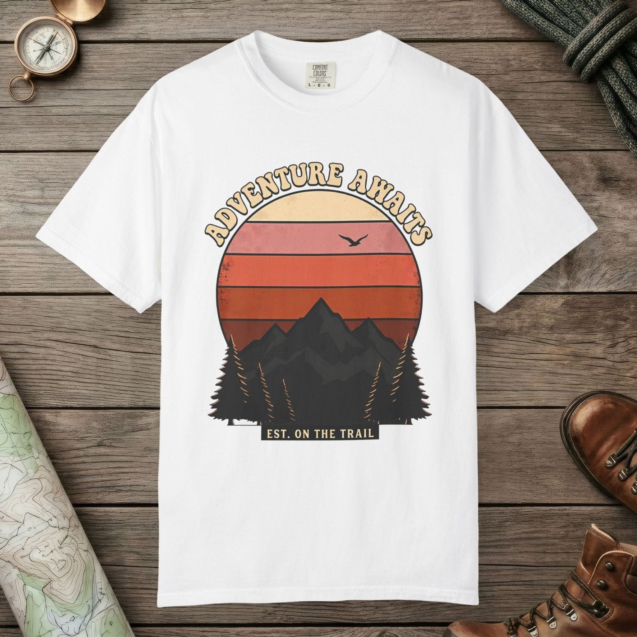 White color unisex graphic t-shirt with "Adventure Awaits Retro Sunset" design