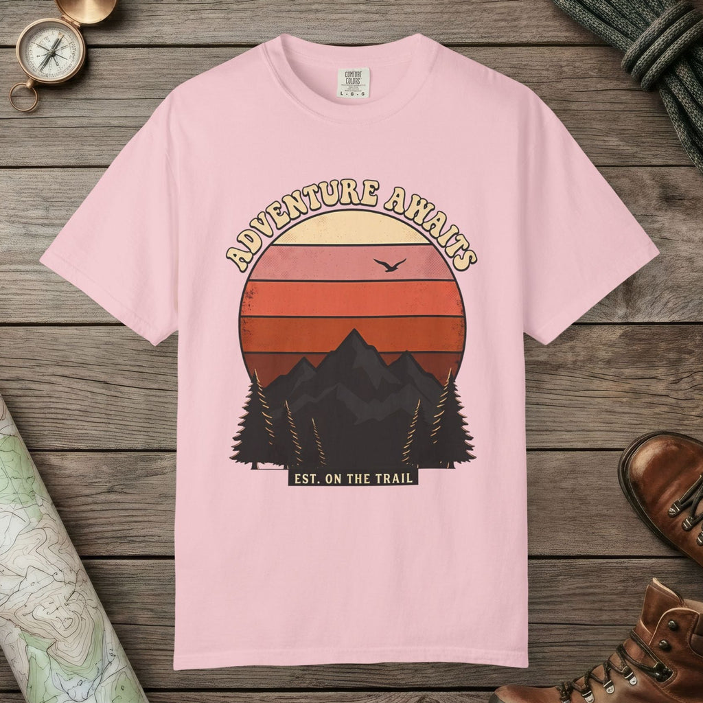 Blossom color unisex graphic t-shirt with "Adventure Awaits Retro Sunset" design