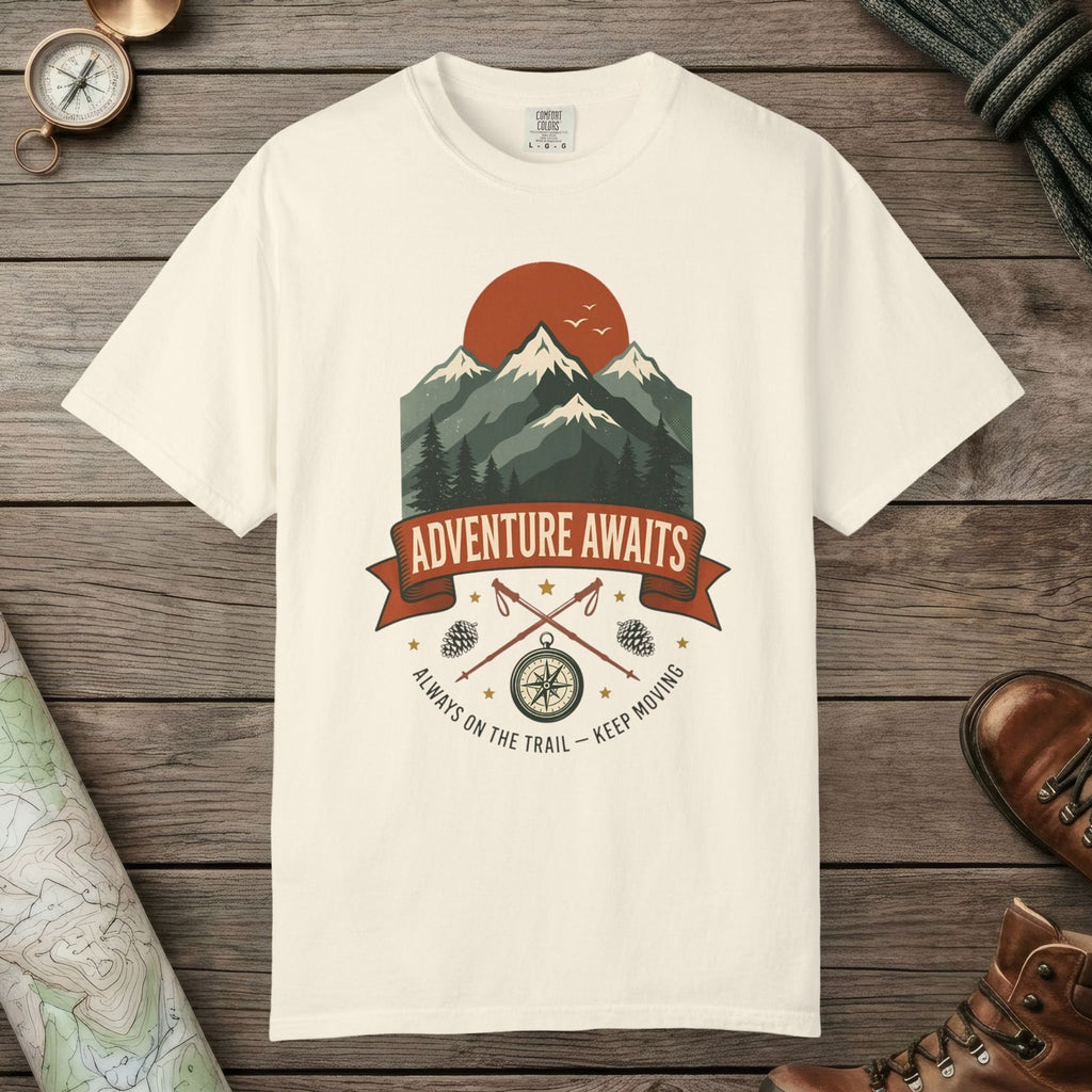 Ivory color unisex graphic t-shirt with "Adventure Awaits" design