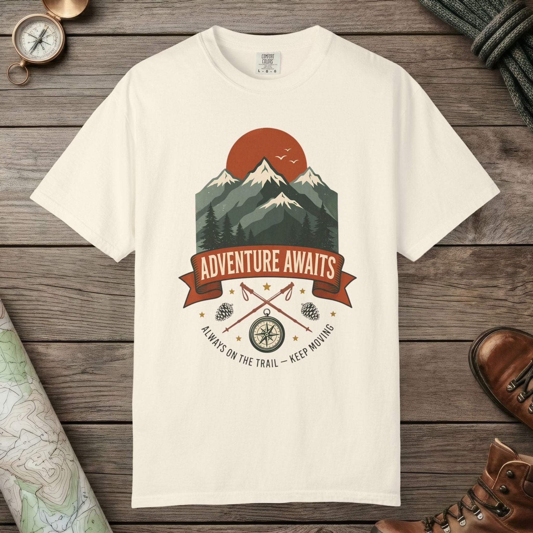 Ivory color unisex graphic t-shirt with "Adventure Awaits" design