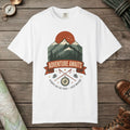 White color unisex graphic t-shirt with "Adventure Awaits" design