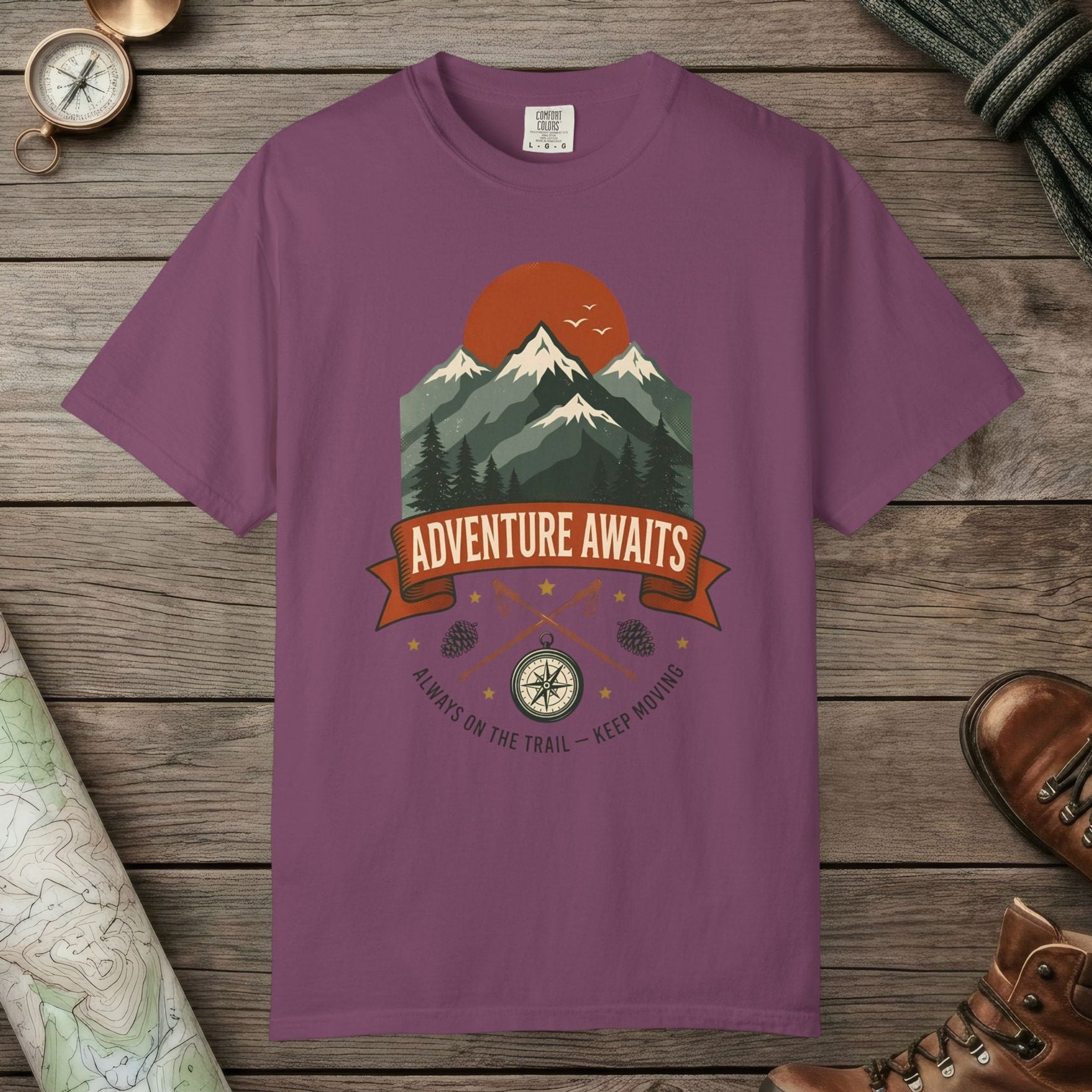 Berry color unisex graphic t-shirt with "Adventure Awaits" design