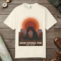 Ivory color unisex graphic t-shirt with "Arches National Park Retro Sunset" design