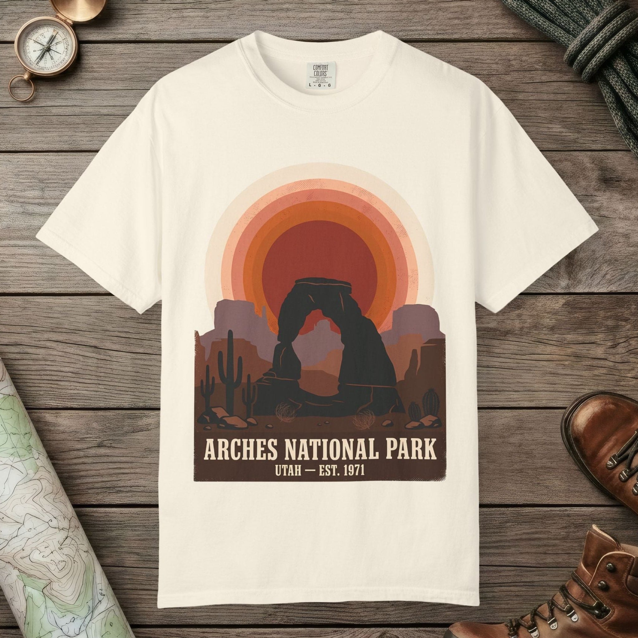 Ivory color unisex graphic t-shirt with "Arches National Park Retro Sunset" design