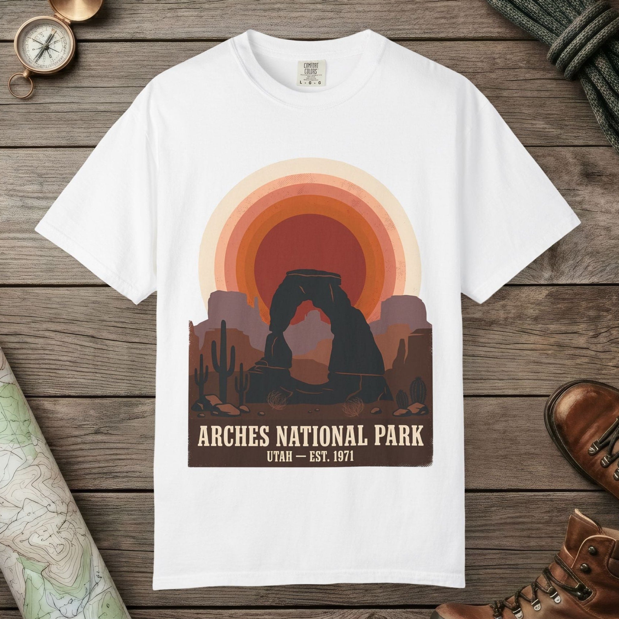 White color unisex graphic t-shirt with "Arches National Park Retro Sunset" design