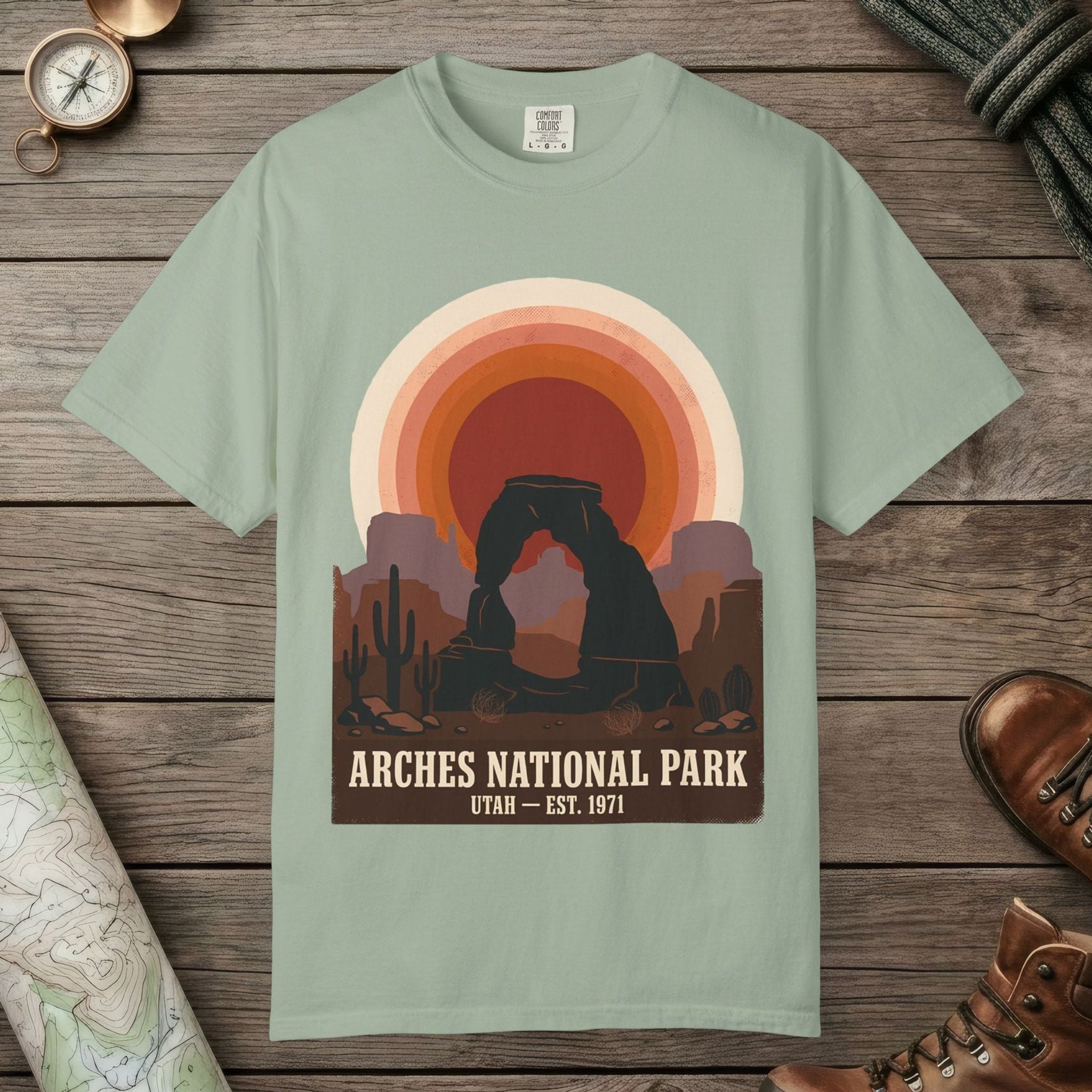 Bay color unisex graphic t-shirt with "Arches National Park Retro Sunset" design