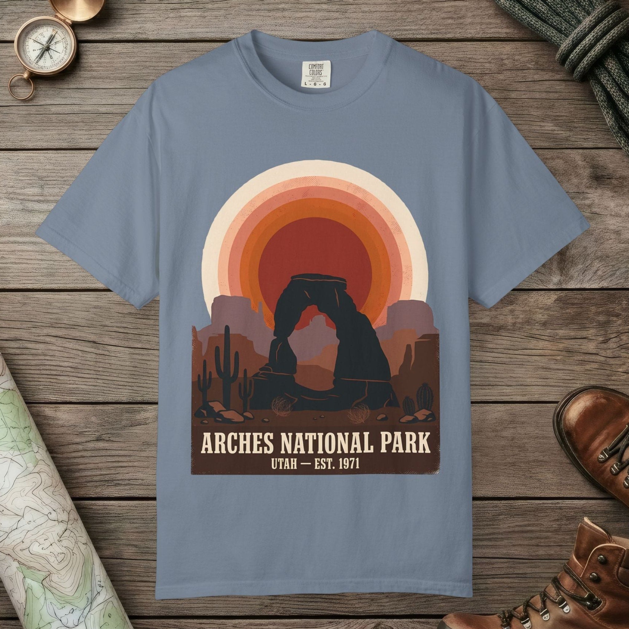 Blue Jean color unisex graphic t-shirt with "Arches National Park Retro Sunset" design