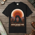 Black color unisex graphic t-shirt with "Arches National Park Retro Sunset" design
