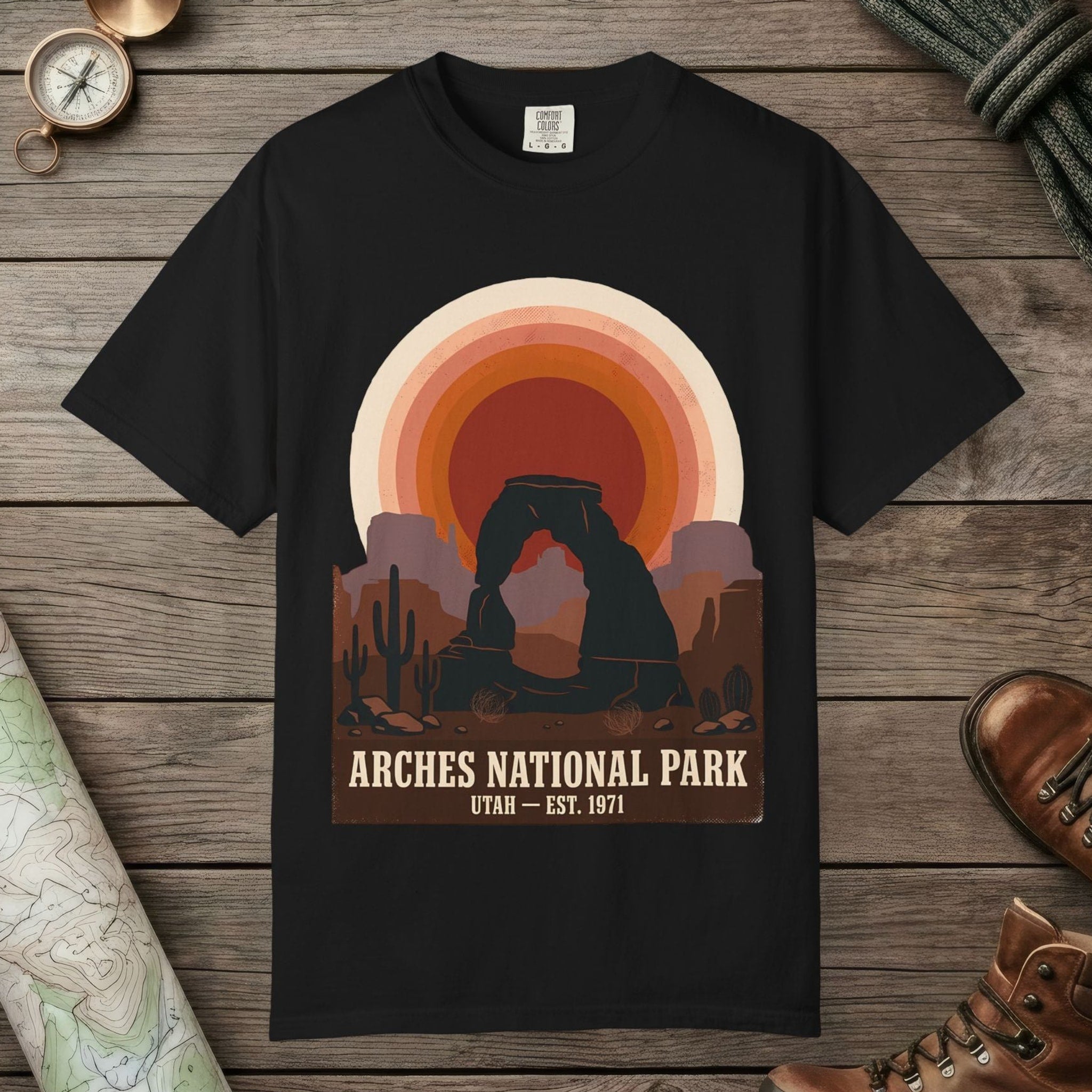 Black color unisex graphic t-shirt with "Arches National Park Retro Sunset" design