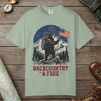 Bay color unisex graphic t-shirt with "Backcountry And Free" design