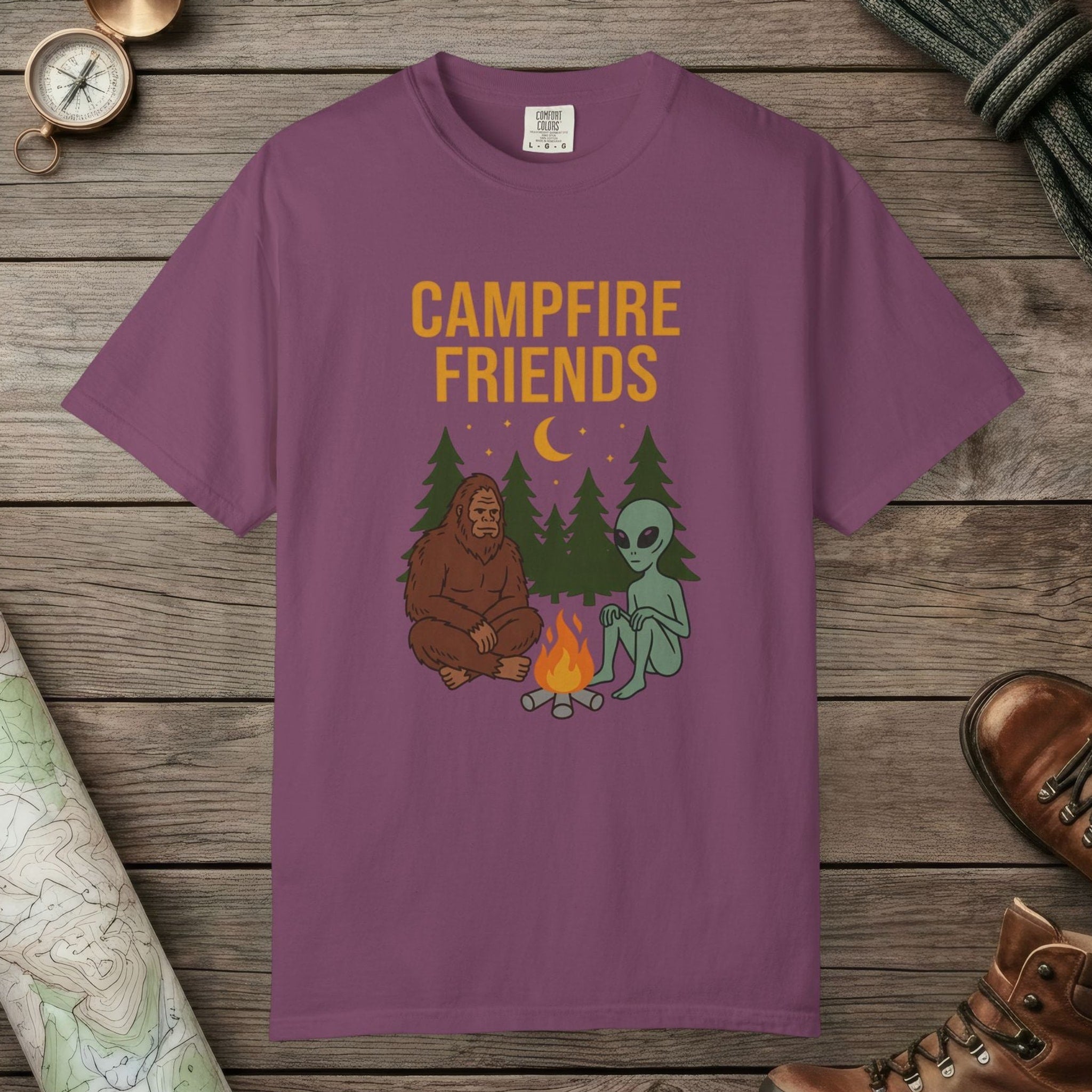 Berry color unisex graphic t-shirt with "Bigfoot And Alien Campfire" design