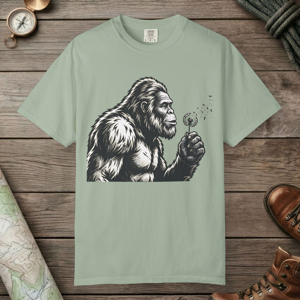 Bay color unisex graphic t-shirt with "Bigfoot Blowing Wishes" design