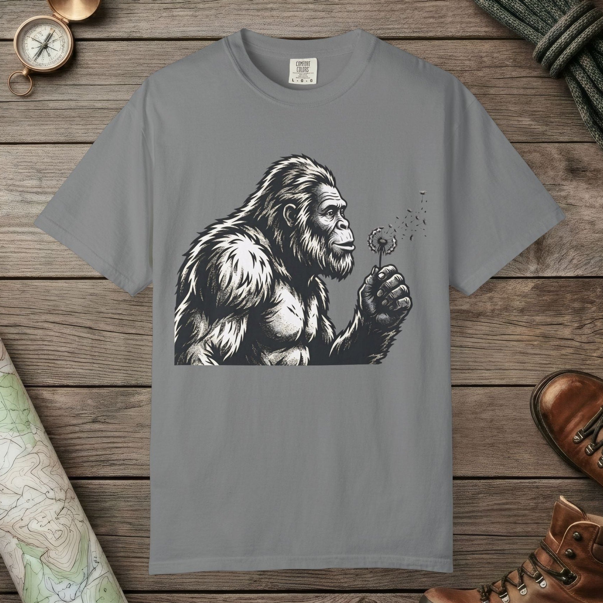 Grey color unisex graphic t-shirt with "Bigfoot Blowing Wishes" design