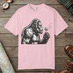 Blossom color unisex graphic t-shirt with "Bigfoot Blowing Wishes" design