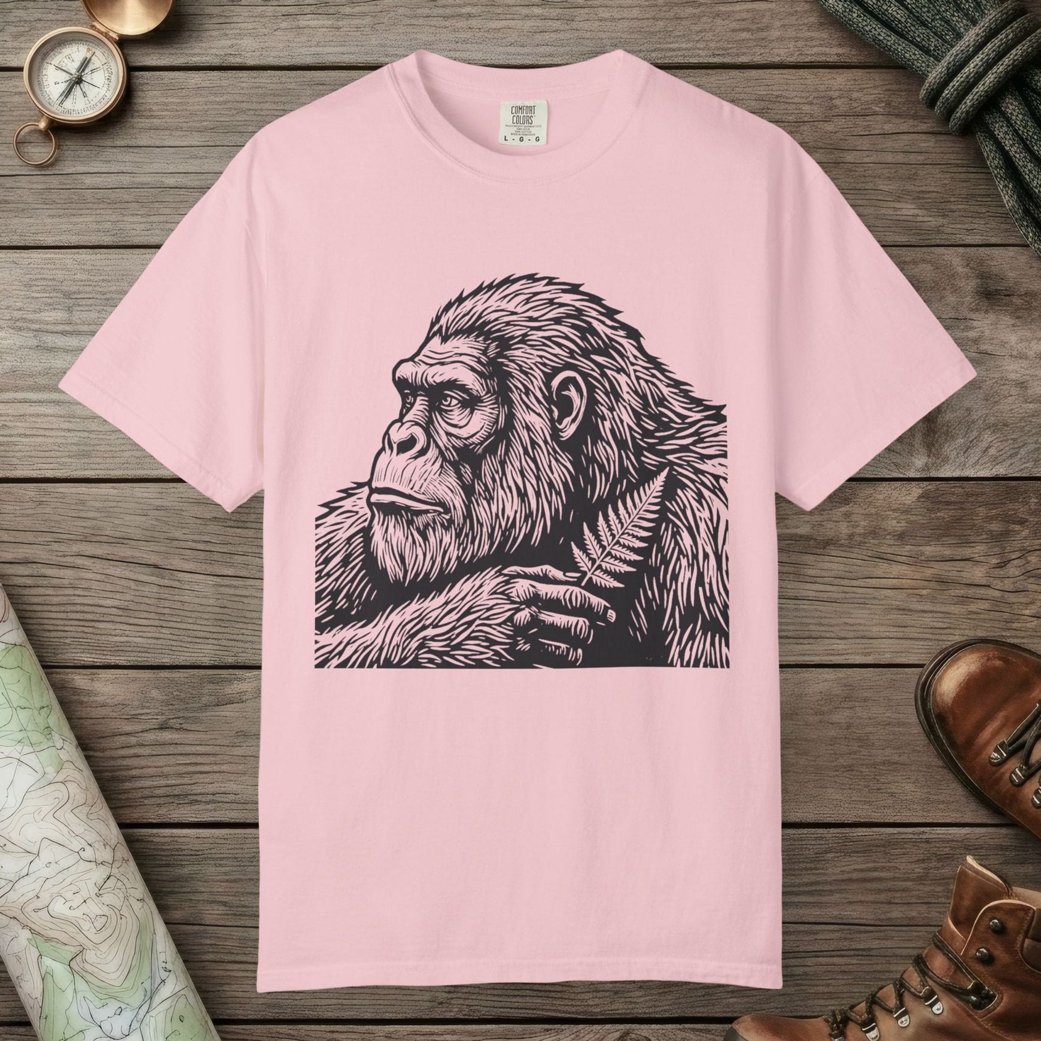 Blossom color unisex graphic t-shirt with "Bigfoot Thinking" design