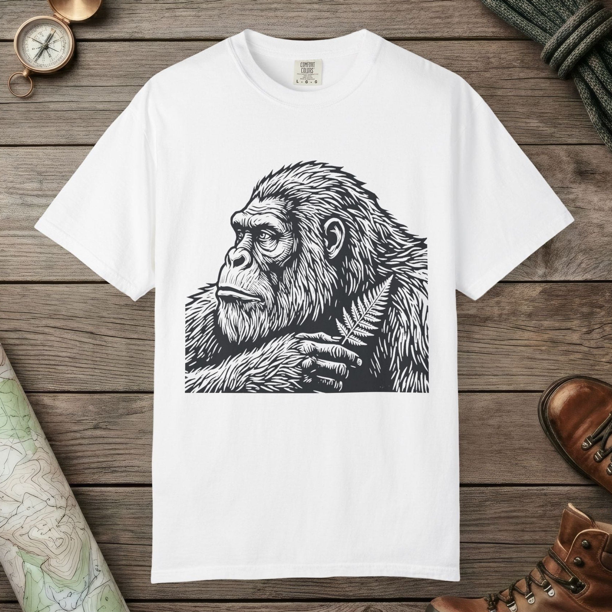 White color unisex graphic t-shirt with "Bigfoot Thinking" design