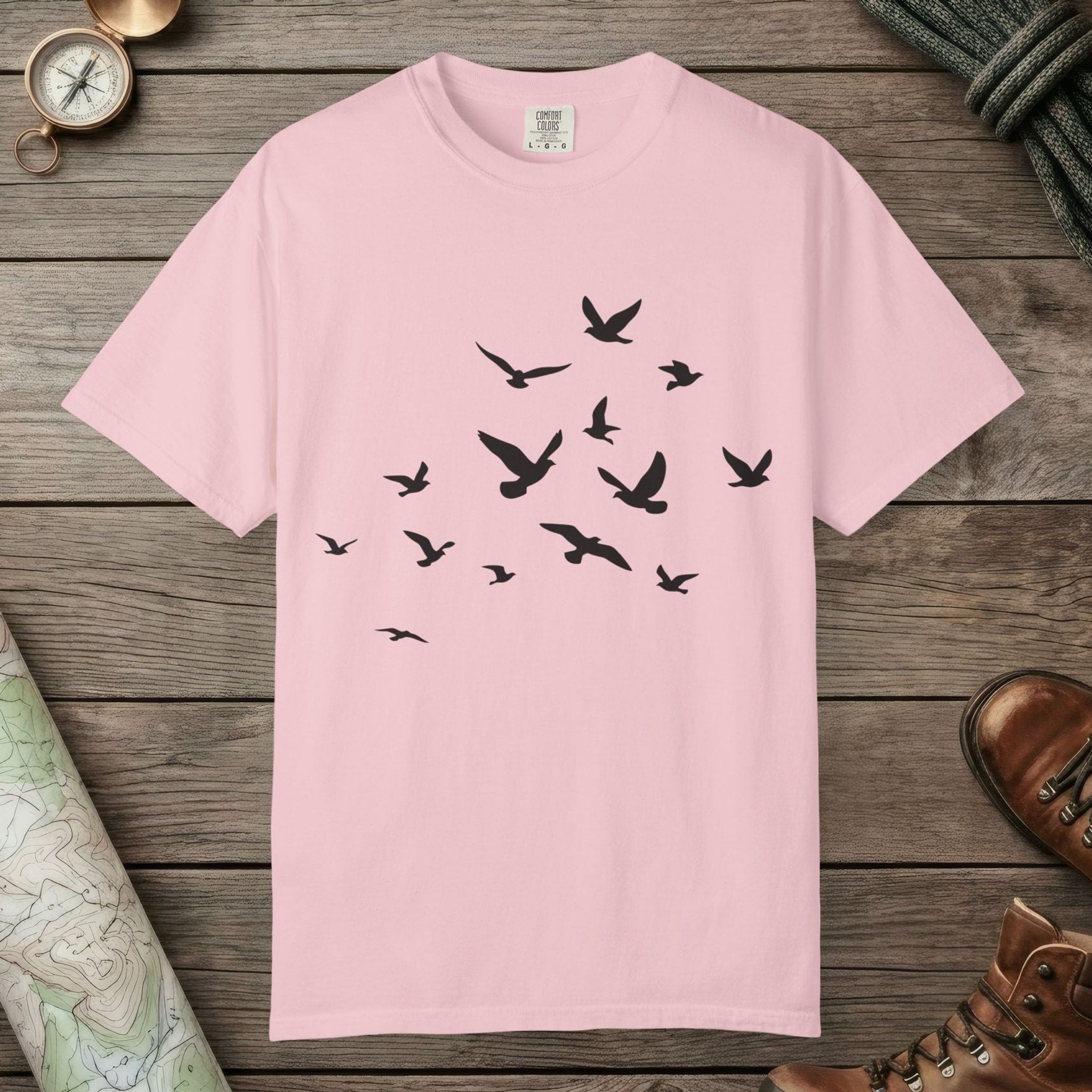 Blossom color unisex graphic t-shirt with "Birds in Flight" design