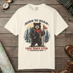 Ivory color unisex graphic t-shirt with "Born To Roam Bear" design