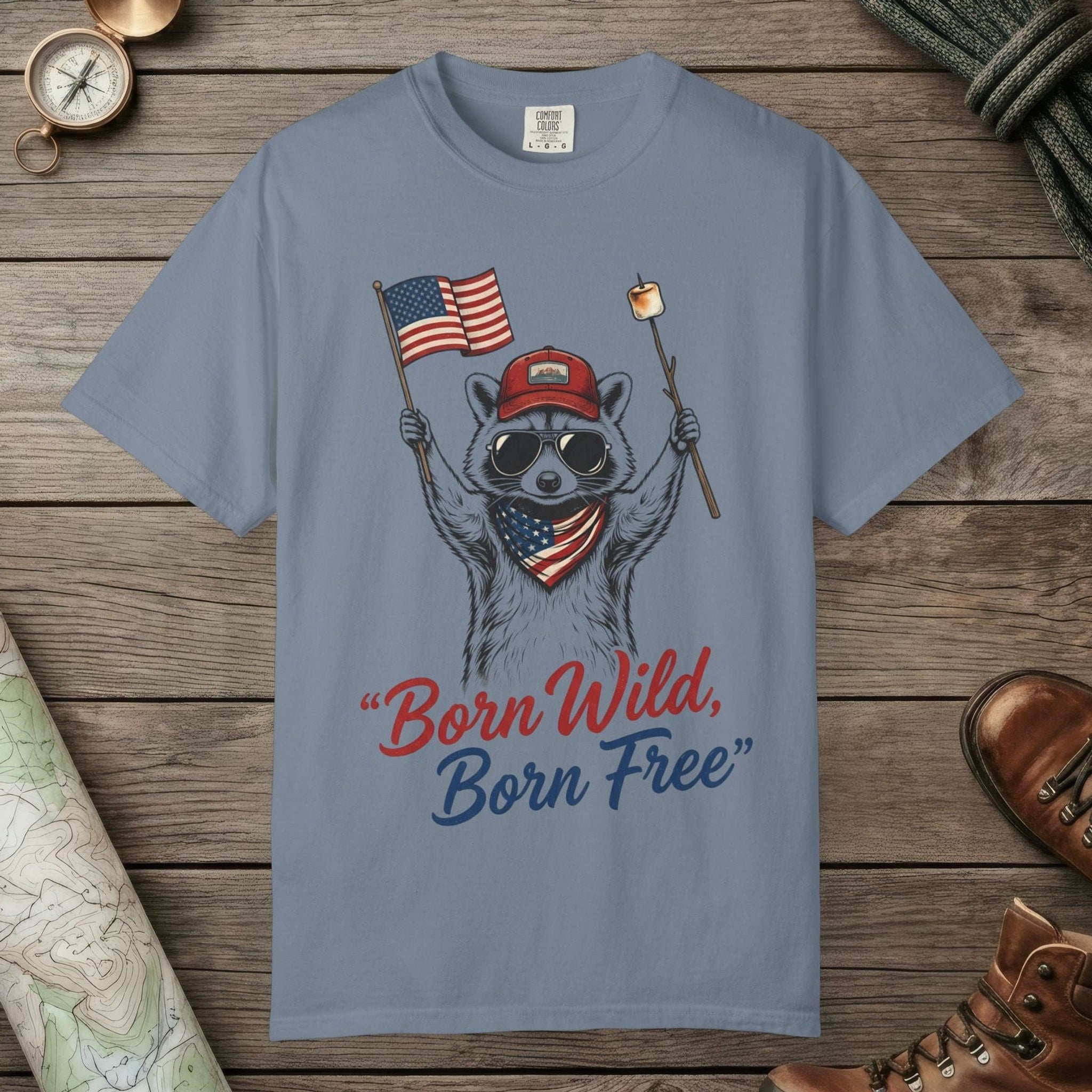 Blue Jean color unisex graphic t-shirt with "Born Wild Raccoon" design