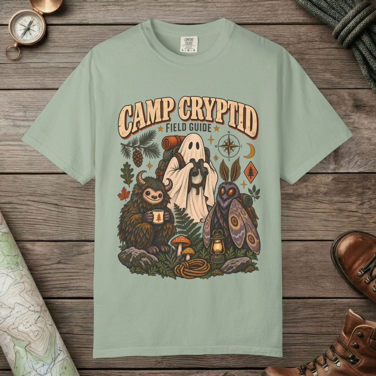 Bay color unisex graphic t-shirt with "Camp Cryptid" design