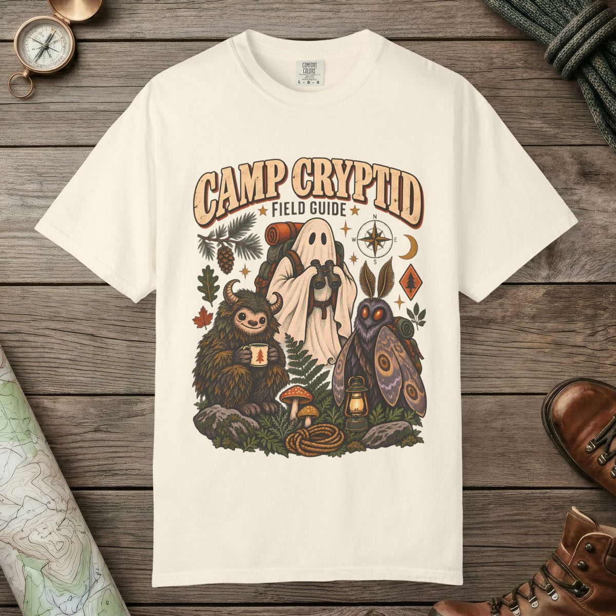 Ivory color unisex graphic t-shirt with "Camp Cryptid" design