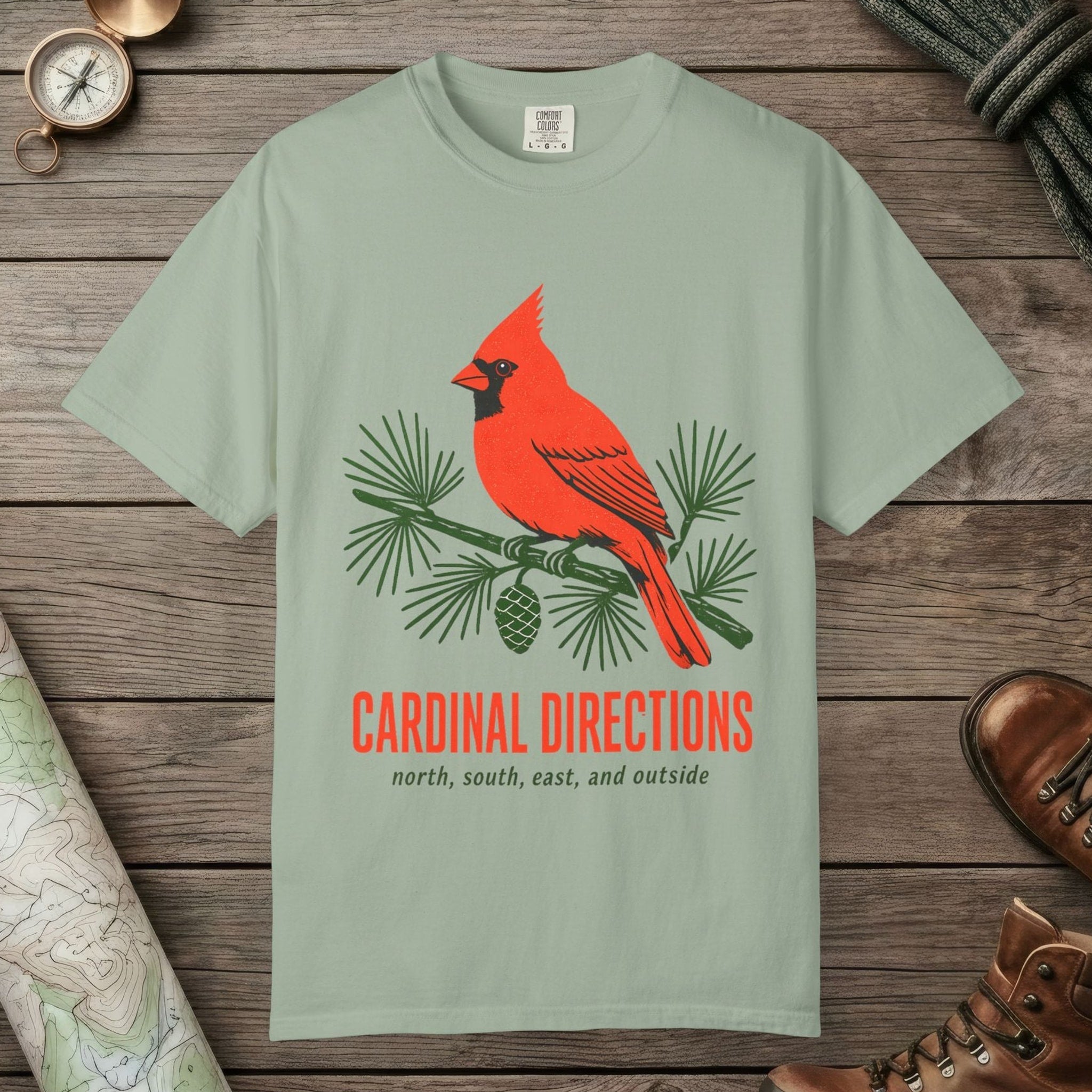 Bay color unisex graphic t-shirt with "Cardinal on Pine" design