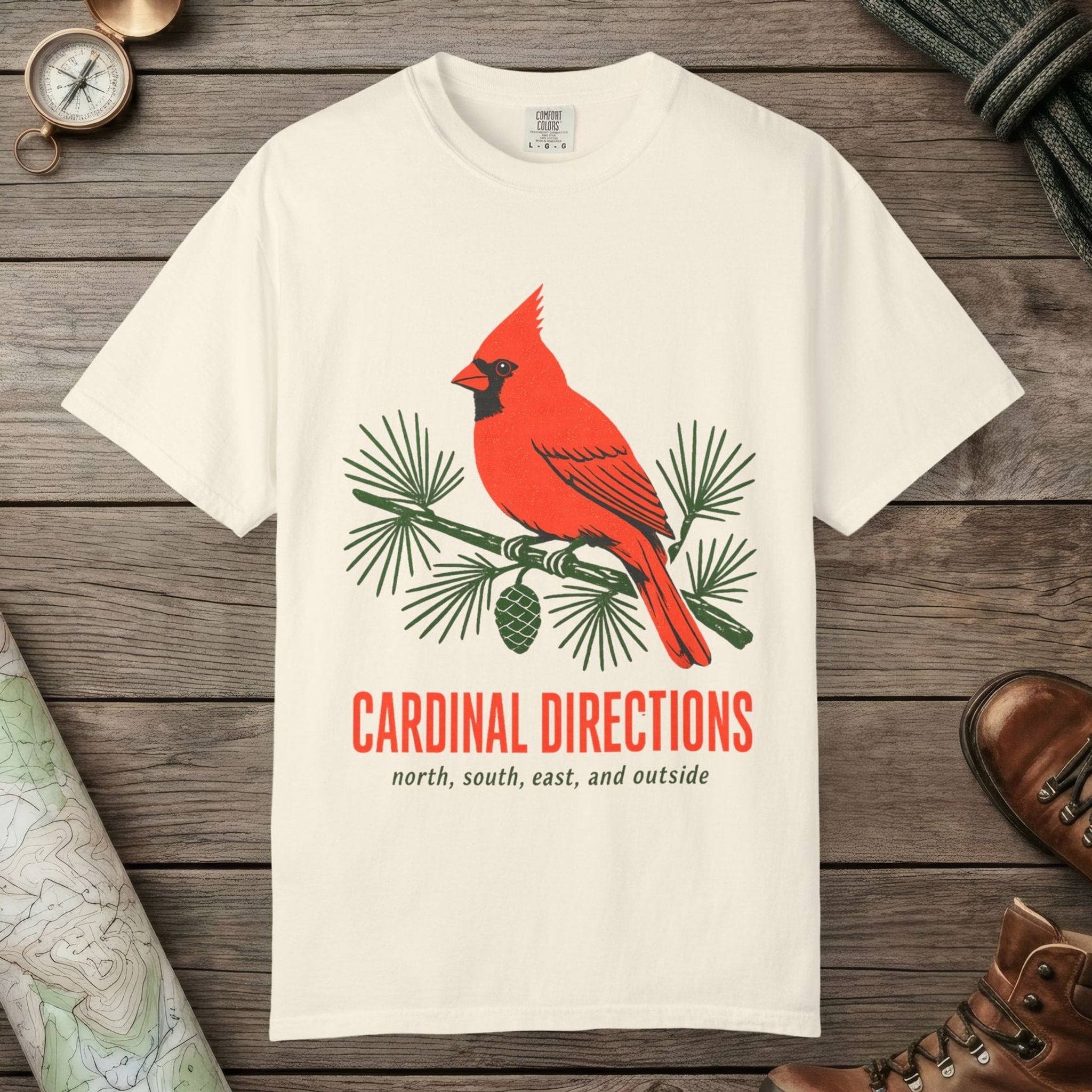 Ivory color unisex graphic t-shirt with "Cardinal on Pine" design