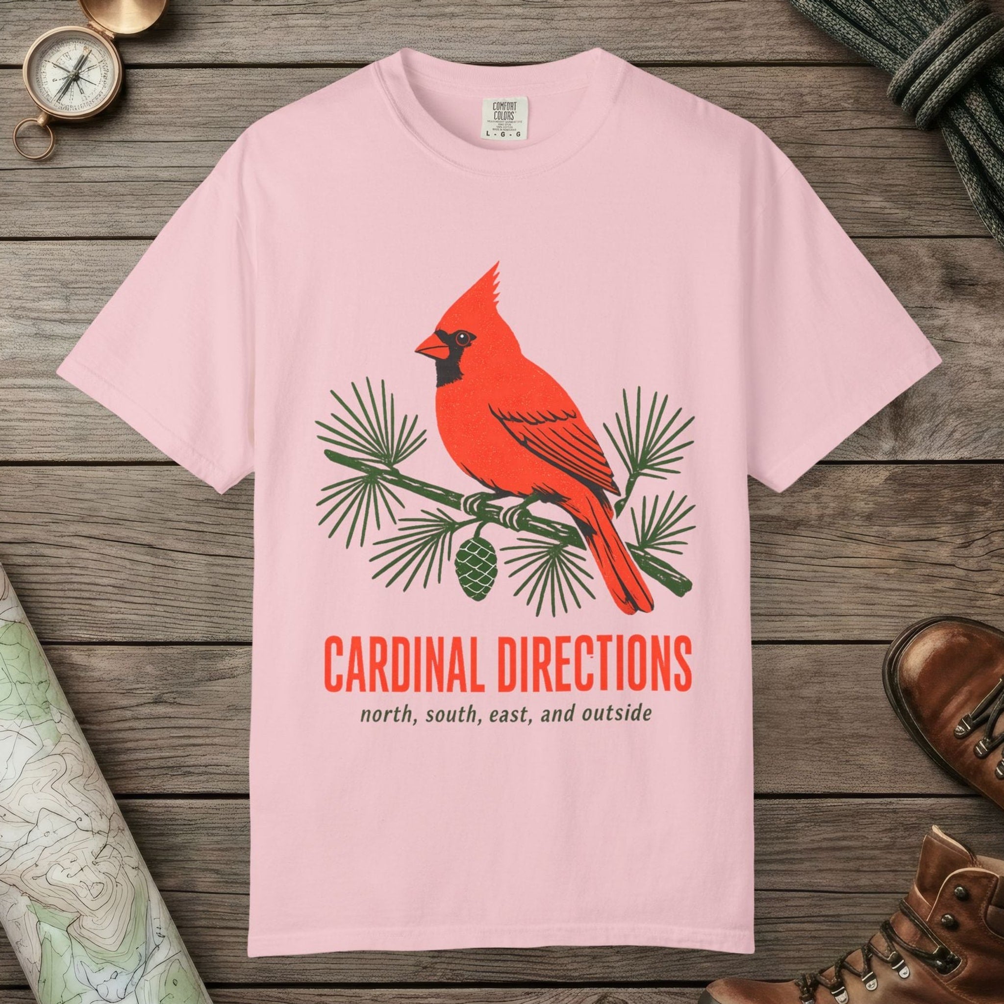 Blossom color unisex graphic t-shirt with "Cardinal on Pine" design