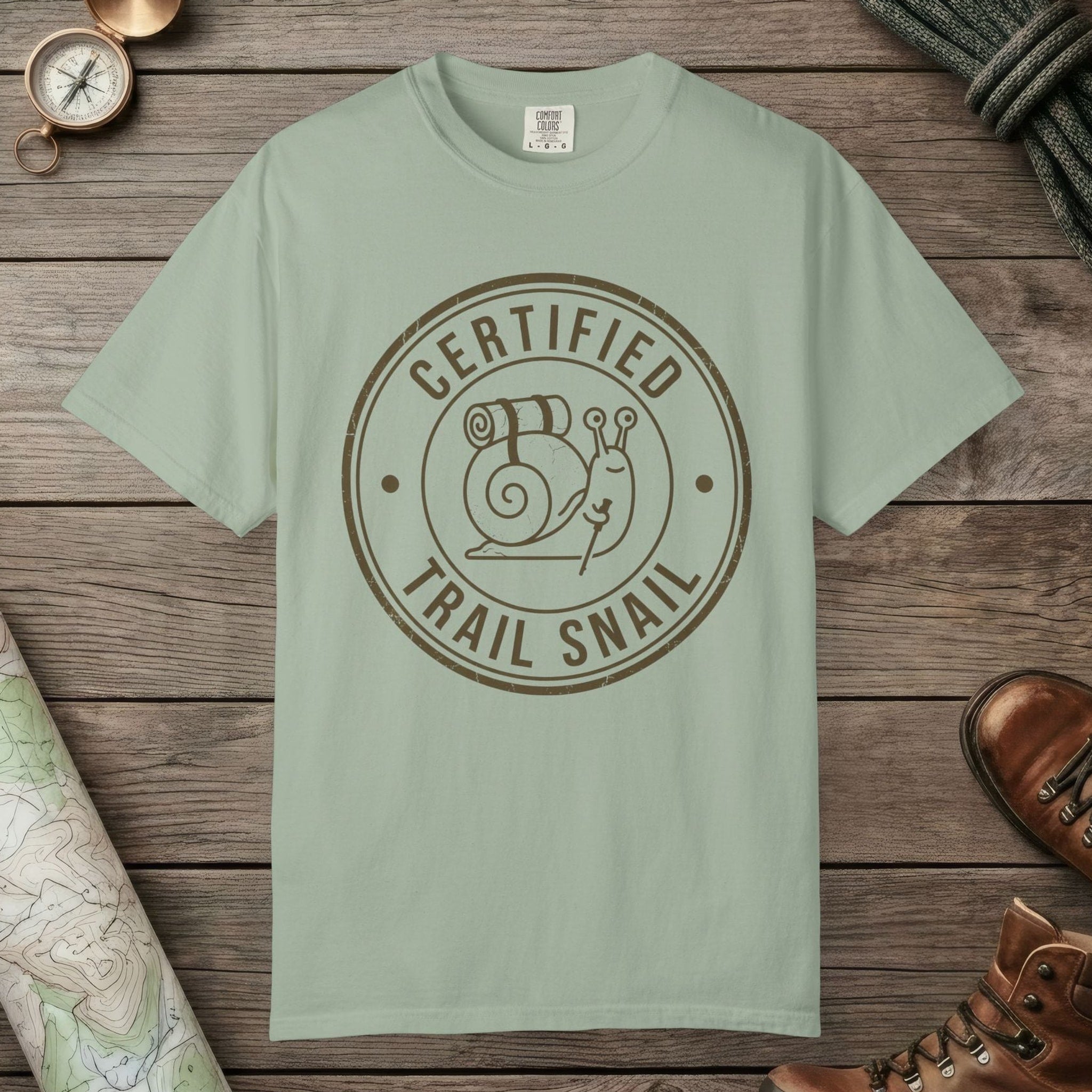 Bay color unisex graphic t-shirt with "Certified Trail Snail" design