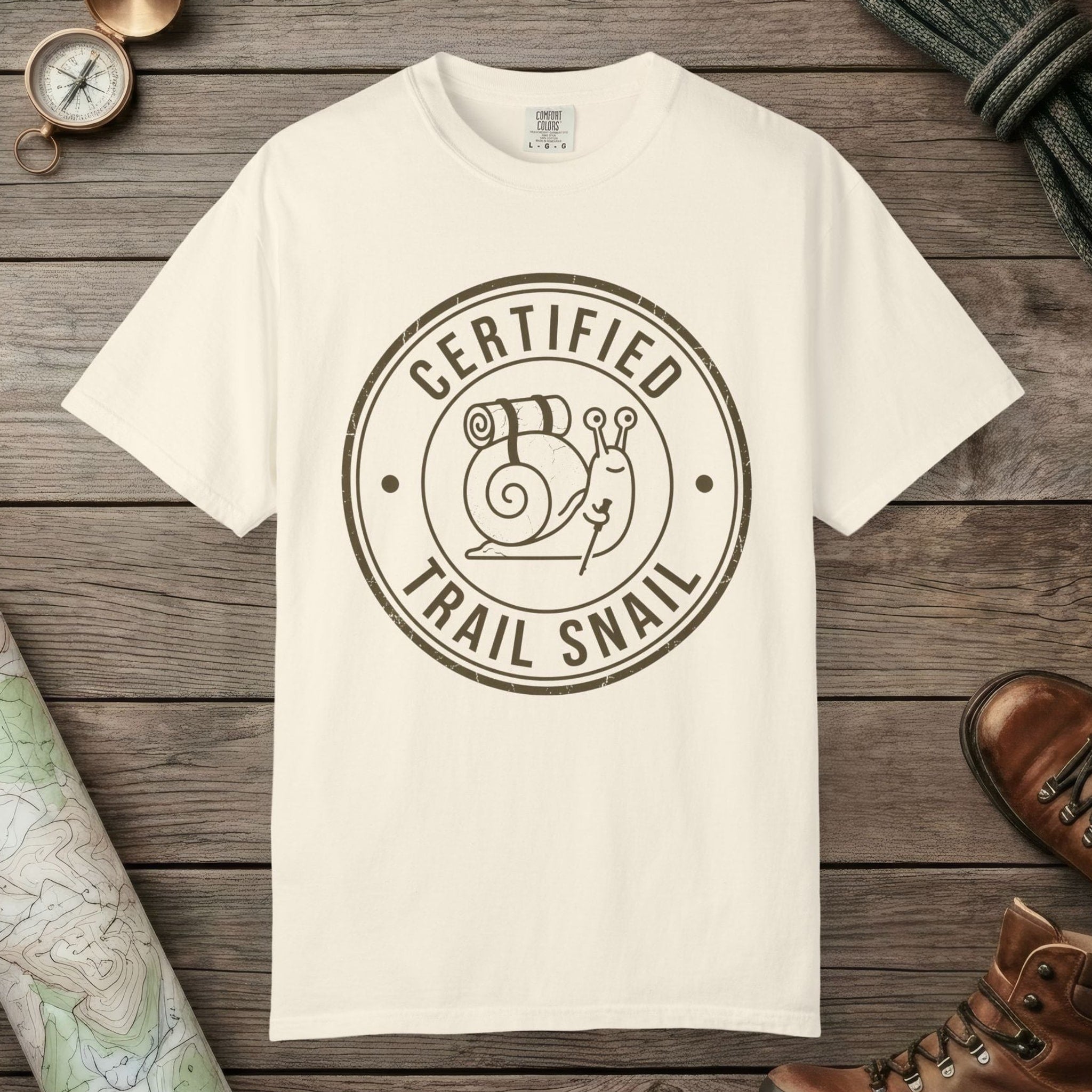 Ivory color unisex graphic t-shirt with "Certified Trail Snail" design
