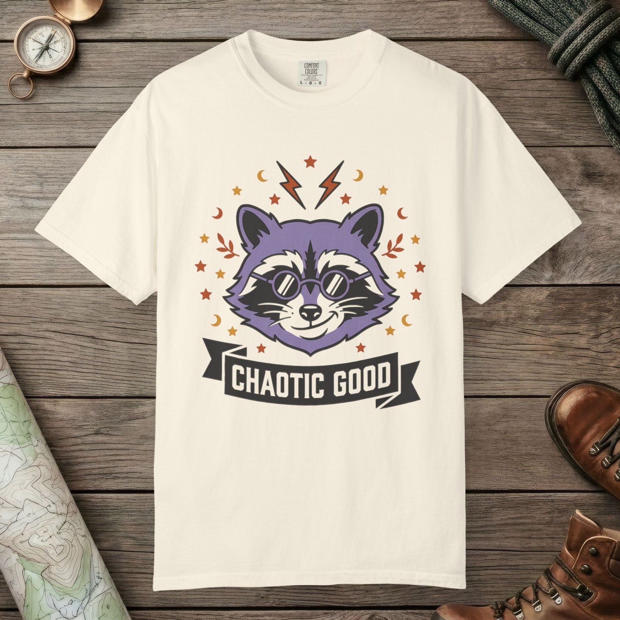Ivory color unisex graphic t-shirt with "Chaotic Good Raccoon" design