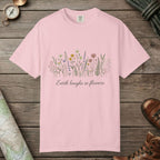 Blossom color unisex graphic t-shirt with "Earth Laughs In Flowers" design