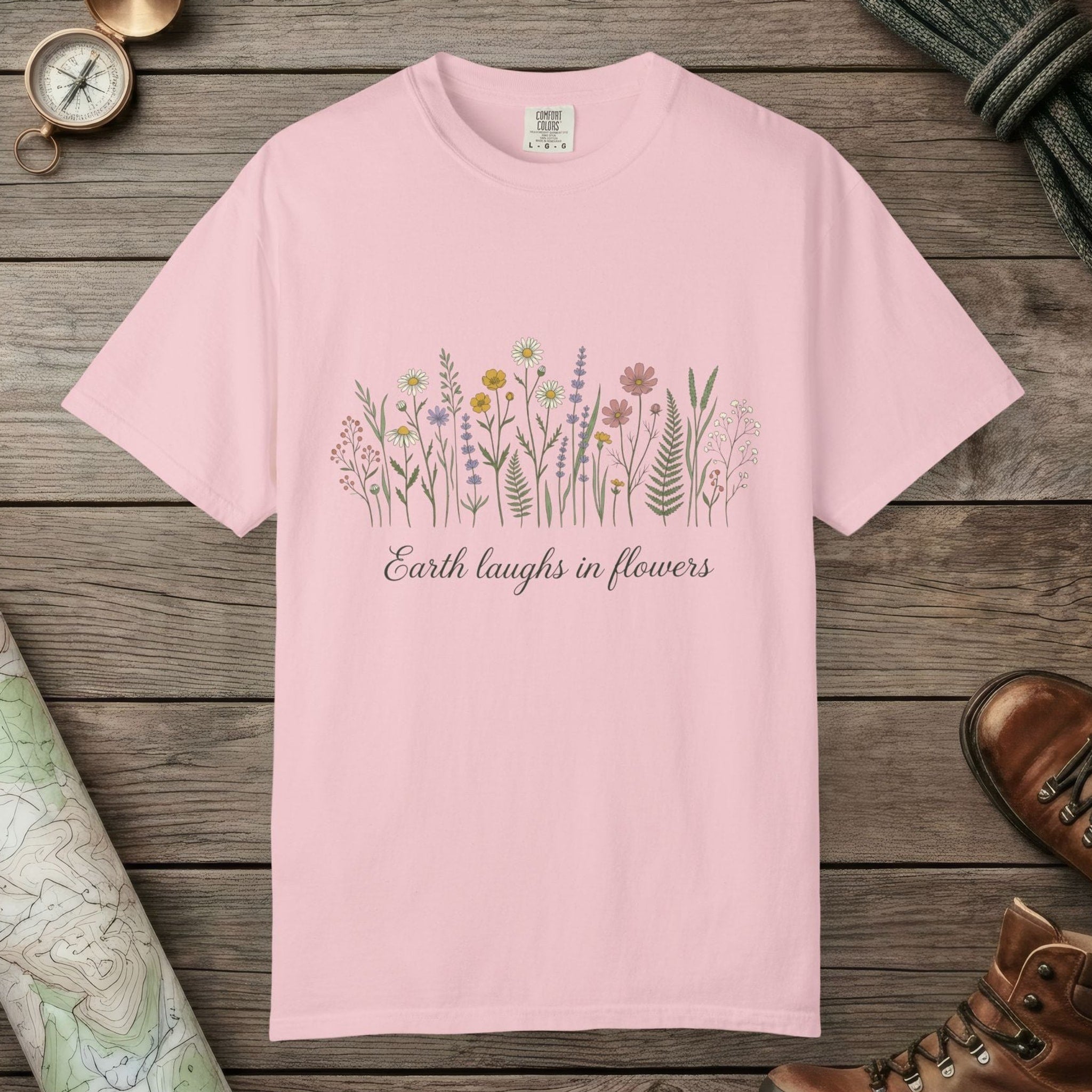 Blossom color unisex graphic t-shirt with "Earth Laughs In Flowers" design