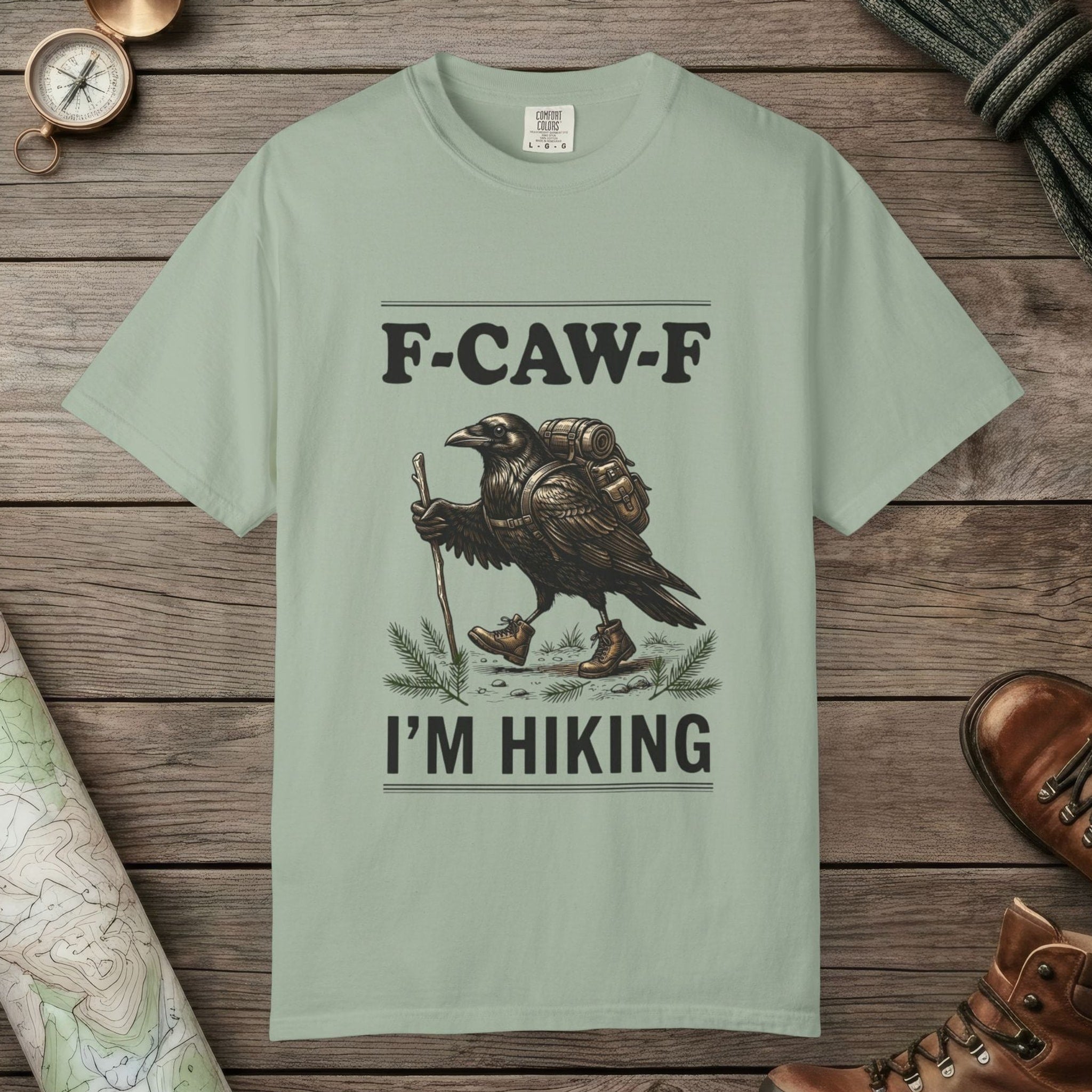 Bay color unisex graphic t-shirt with "F-Caw-F I'm Hiking" design