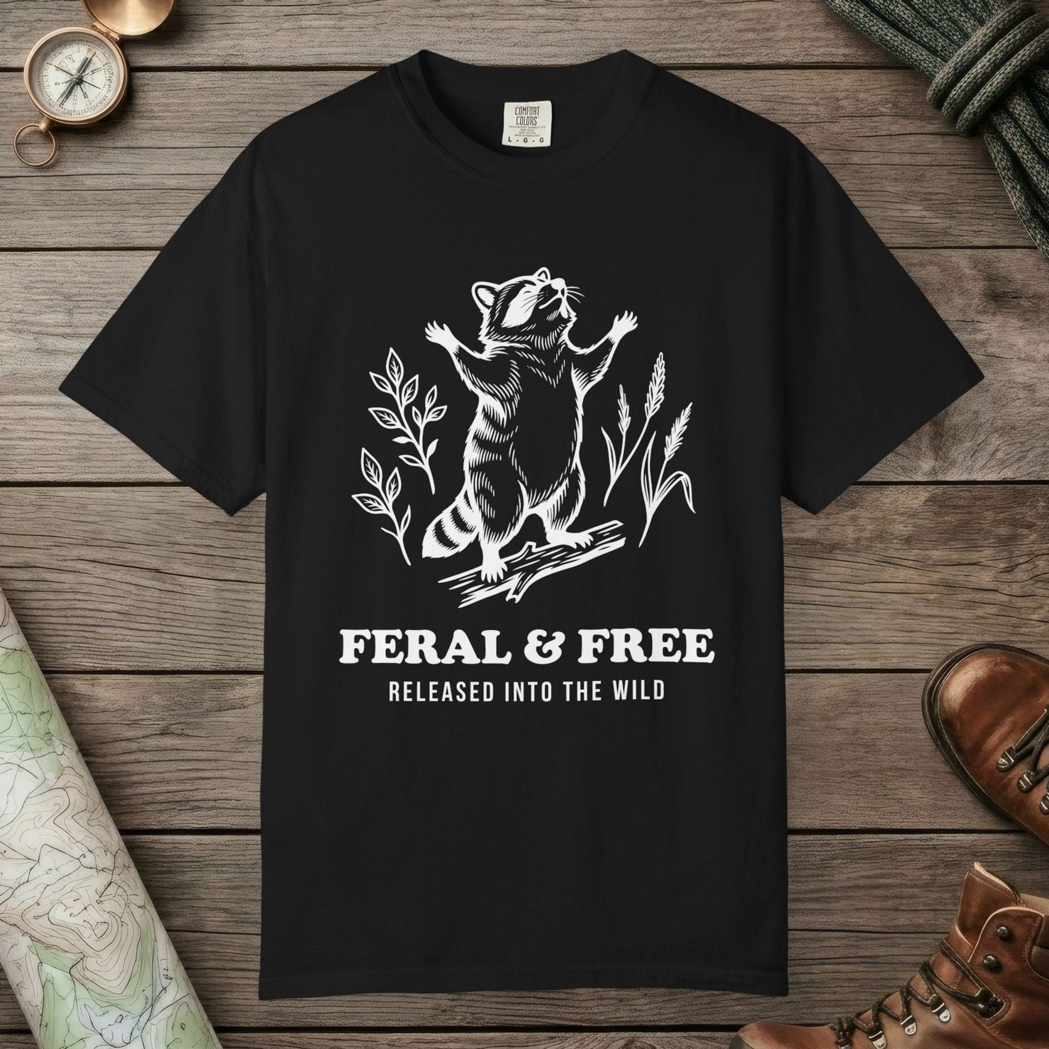 Black color unisex graphic t-shirt with "Feral & Free" design