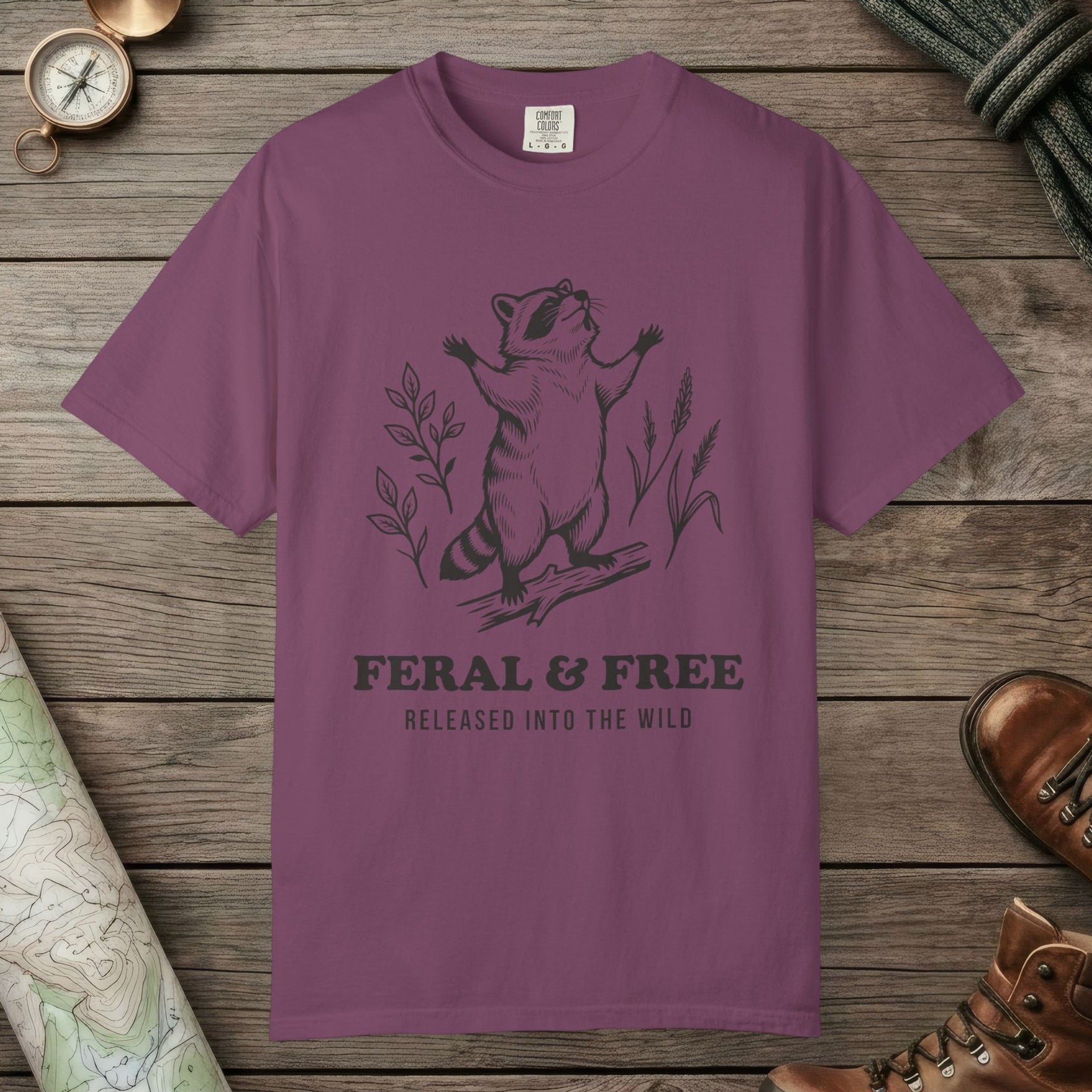 Berry color unisex graphic t-shirt with "Feral & Free" design
