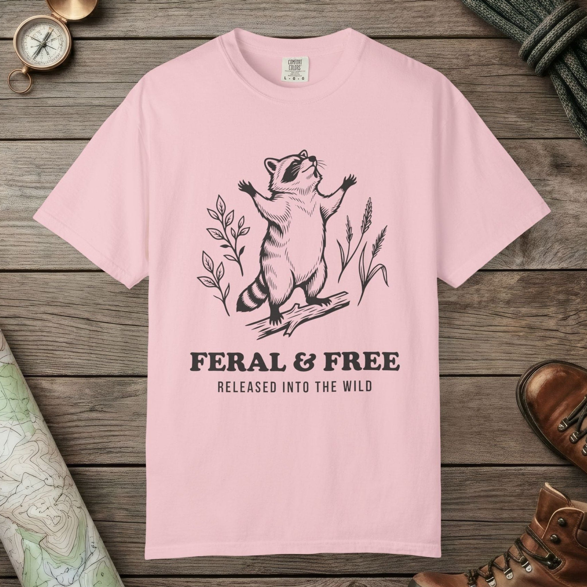 Blossom color unisex graphic t-shirt with "Feral & Free" design