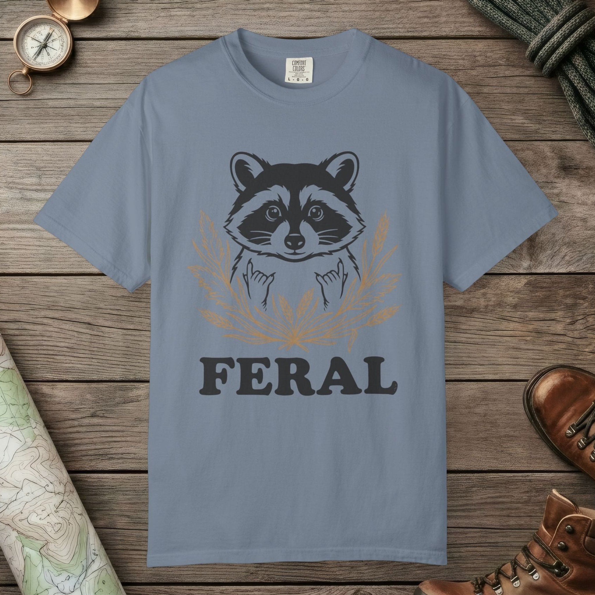 Blue Jean color unisex graphic t-shirt with "Feral Raccoon" design