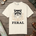 Ivory color unisex graphic t-shirt with "Feral Raccoon" design