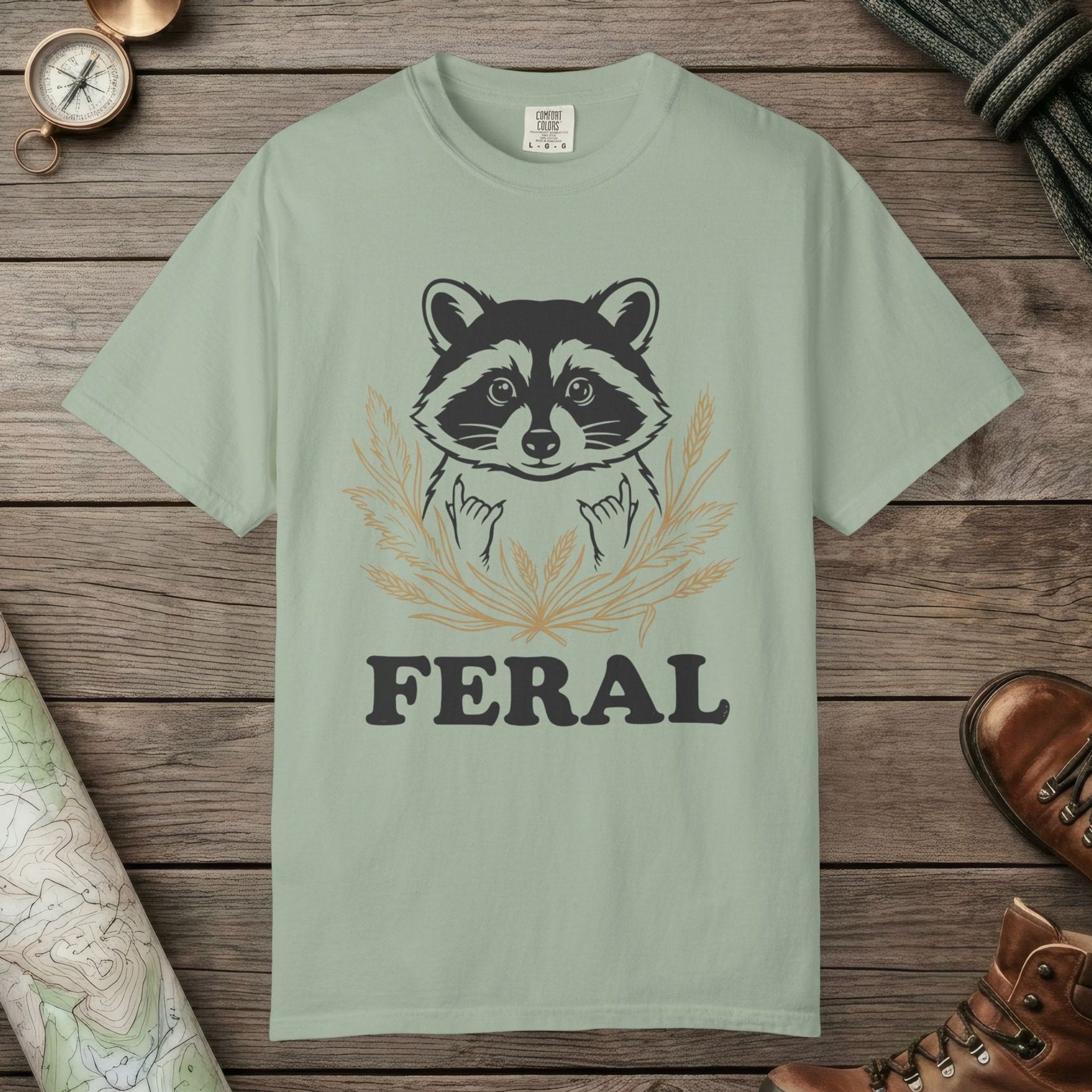 Bay color unisex graphic t-shirt with "Feral Raccoon" design