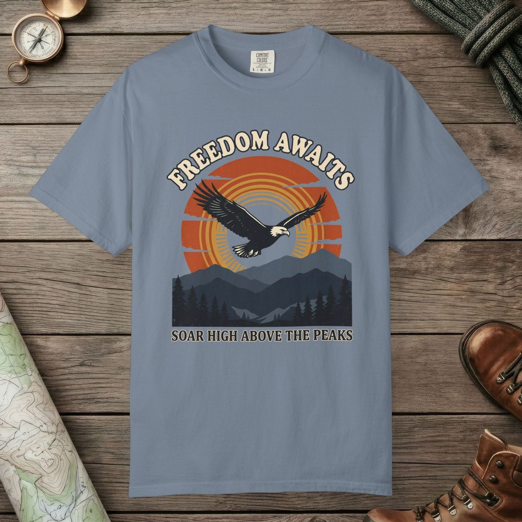 Blue Jean color unisex graphic t-shirt with "Freedom Awaits" design