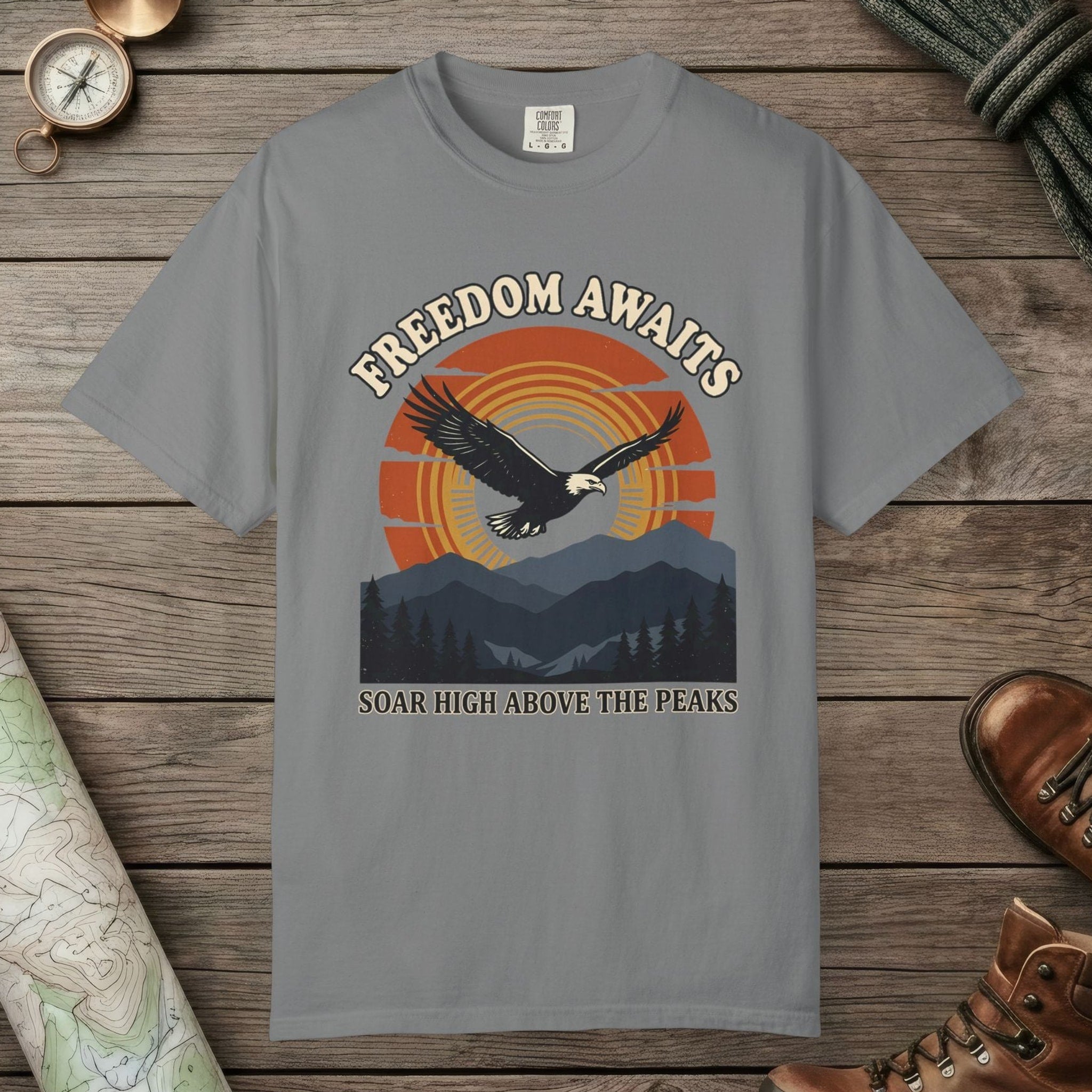 Grey color unisex graphic t-shirt with "Freedom Awaits" design