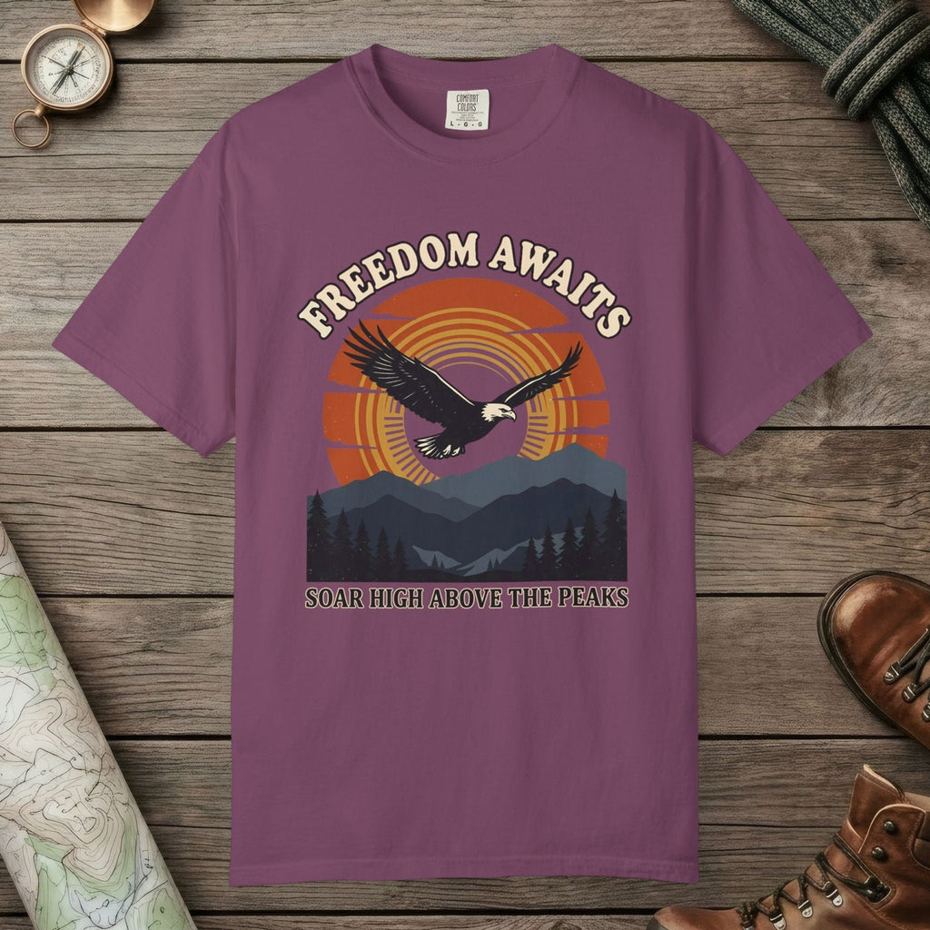 Berry color unisex graphic t-shirt with "Freedom Awaits" design