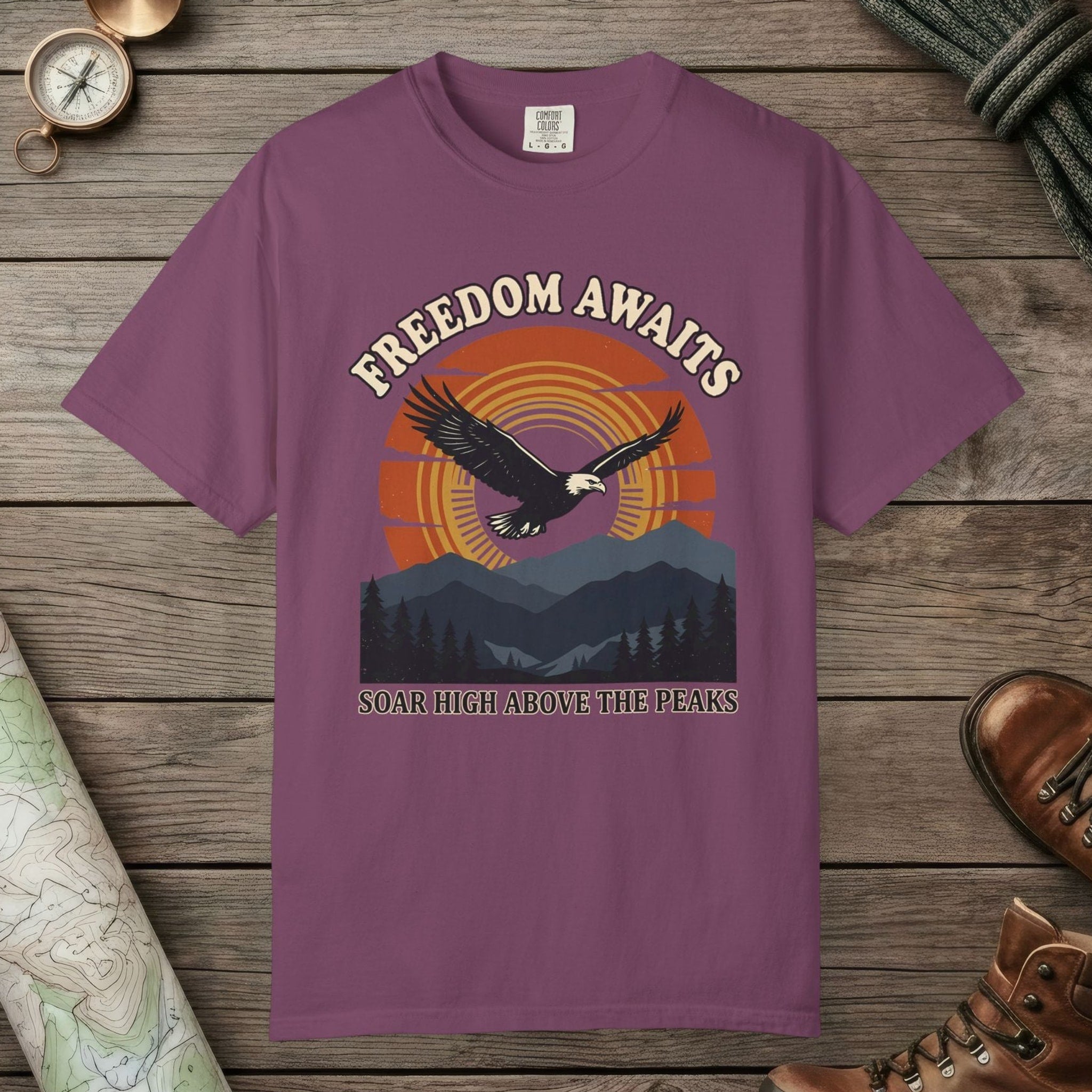Berry color unisex graphic t-shirt with "Freedom Awaits" design