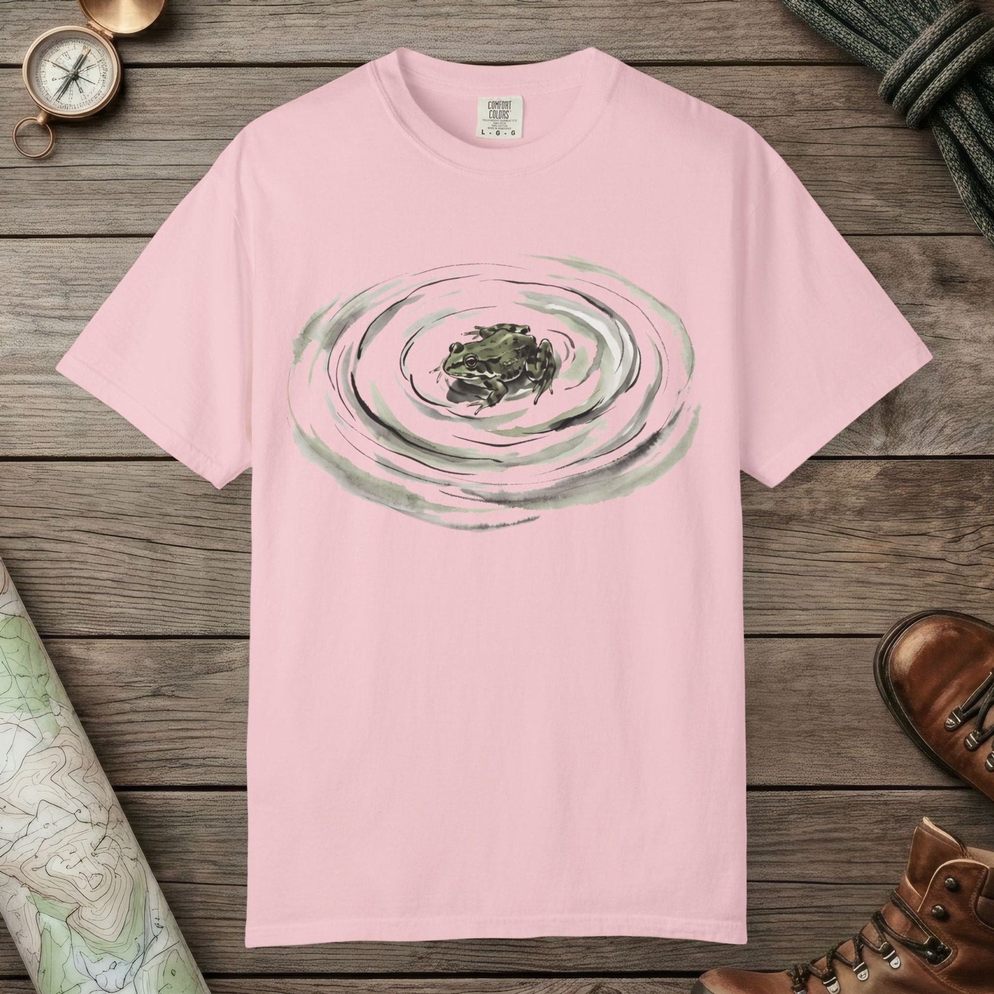 Blossom color unisex graphic t-shirt with "Frog Swimming" design