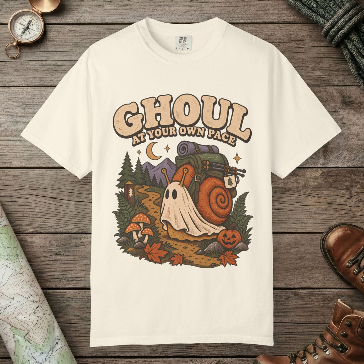 Ivory color unisex graphic t-shirt with "Ghoul At Own Pace" design