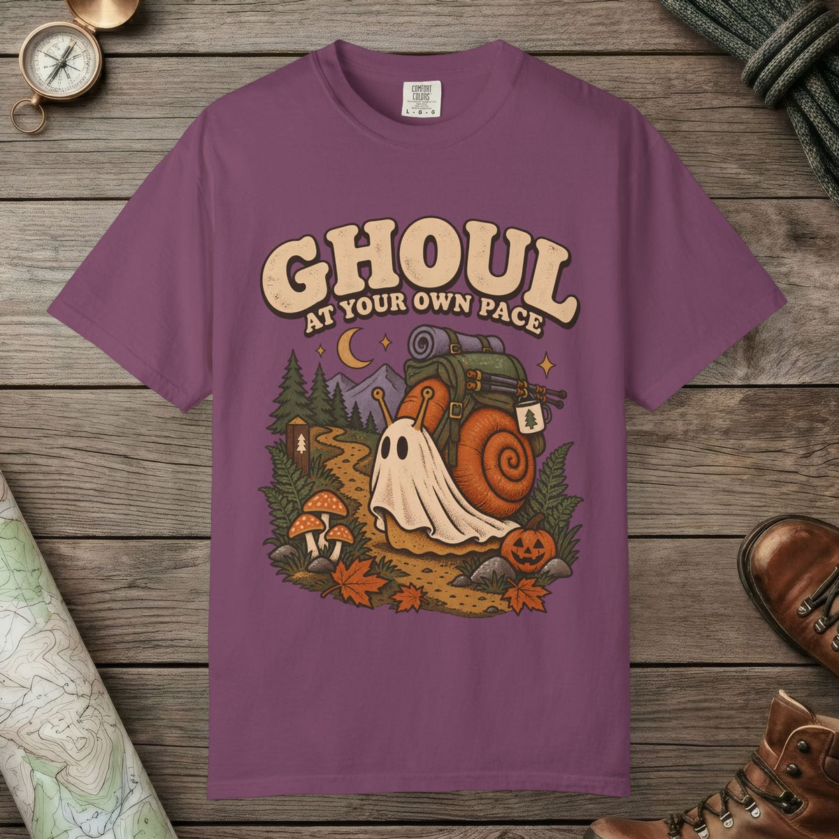 Berry color unisex graphic t-shirt with "Ghoul At Own Pace" design