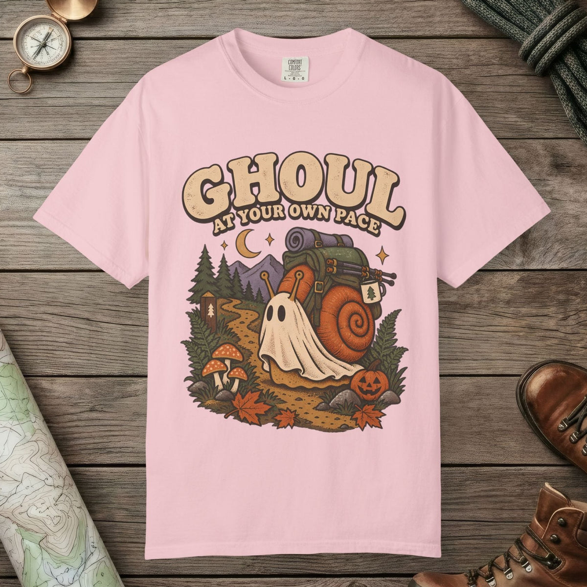 Blossom color unisex graphic t-shirt with "Ghoul At Own Pace" design